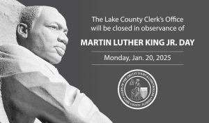A marble statue of Dr. Martin Luther King, Jr. and the words, "The Lake County Clerk's office will be closed in observance of Martin Luther King, Jr. Day Monday, Jan. 20, 2025."