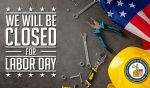 A variety of tools, nuts and bolts, an American Flag, and a hard hat lay on a concrete surface, and the words "We will be Closed for Labor Day."