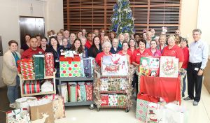 Clerk Gary Cooney and staff are joined by Linda Krupski, founder of LovExtension, along with volunteer representatives from the organization.
