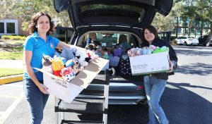 Employees of the Clerk’s Office load donated stuffed animals for delivery to the Haven of Lake and Sumter Counties.
