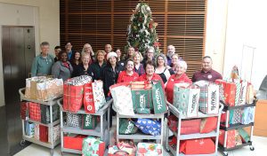 Employees from the Clerk’s Office are joined by Linda Krupski, founder of LovExtension as they present the donated items.