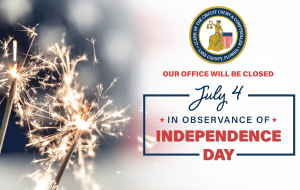 Celebratory firework sparklers are burning with an American Flag in the background and the words, "Our Office will be closed July 4 in observance of Independence Day."