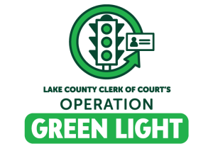 A street light with all green lights and the words Lake County Clerk of the Court's Operation Green Light