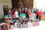 Employees from the Clerk’s Office are joined by Linda Krupski, founder of LovExtension as they present the donated items.