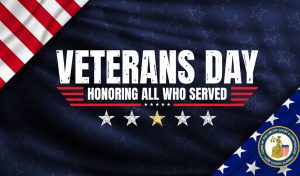 A dark blue background, with the American Flag and the words "Veterans Day - Honoring All Who Served"